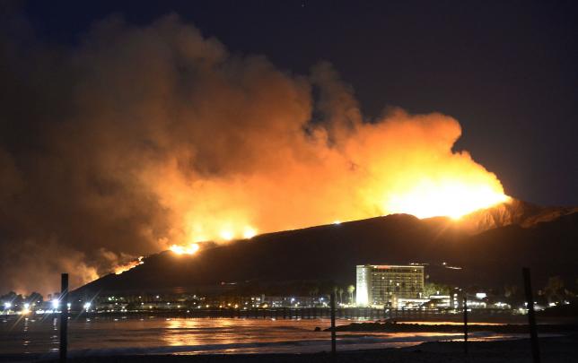 Huge flames light up the coast line the Solimar brush fire that started early Saturday morning in Ventura County